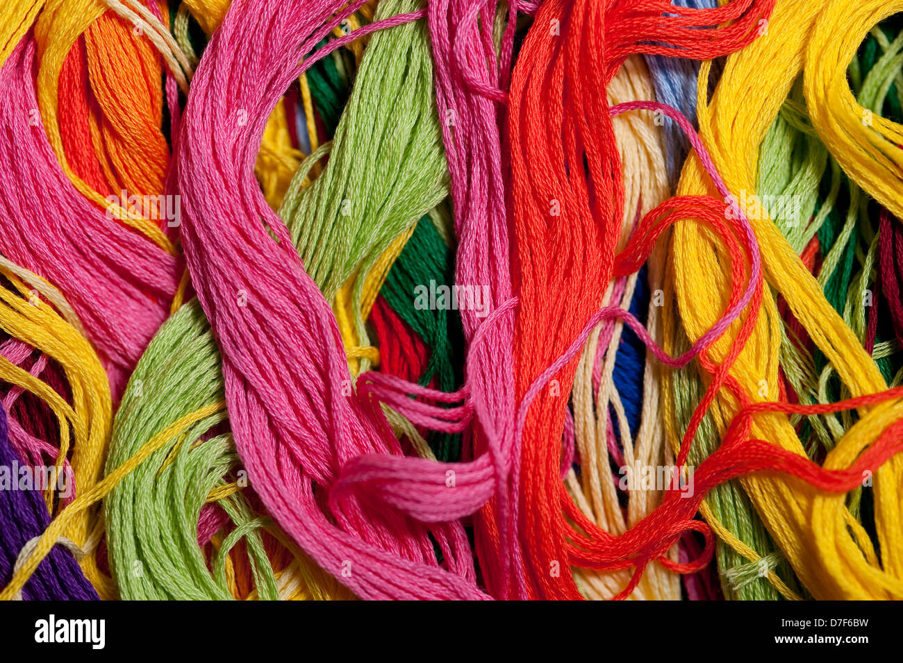 Multicolored embroidery thread mixed up and tangled Stock Photo