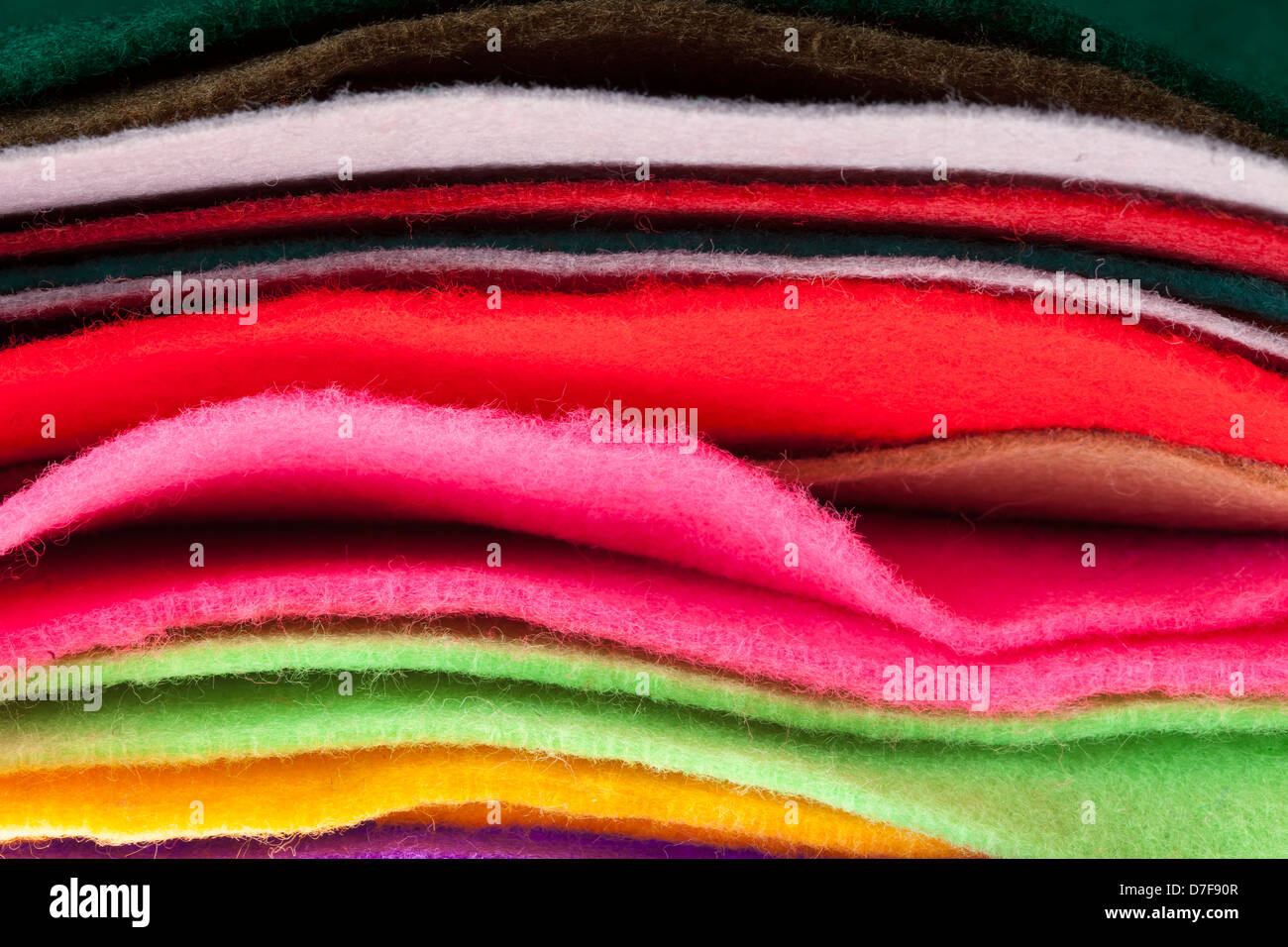 Felt fabric sheets in various colors piled up in a stack. Stock Photo