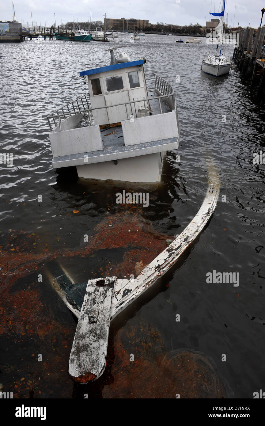BROOKLYN, NY - OCTOBER 30: Sinked boat in the Sheepsheadbay channel due to impact from Hurricane Sandy Stock Photo