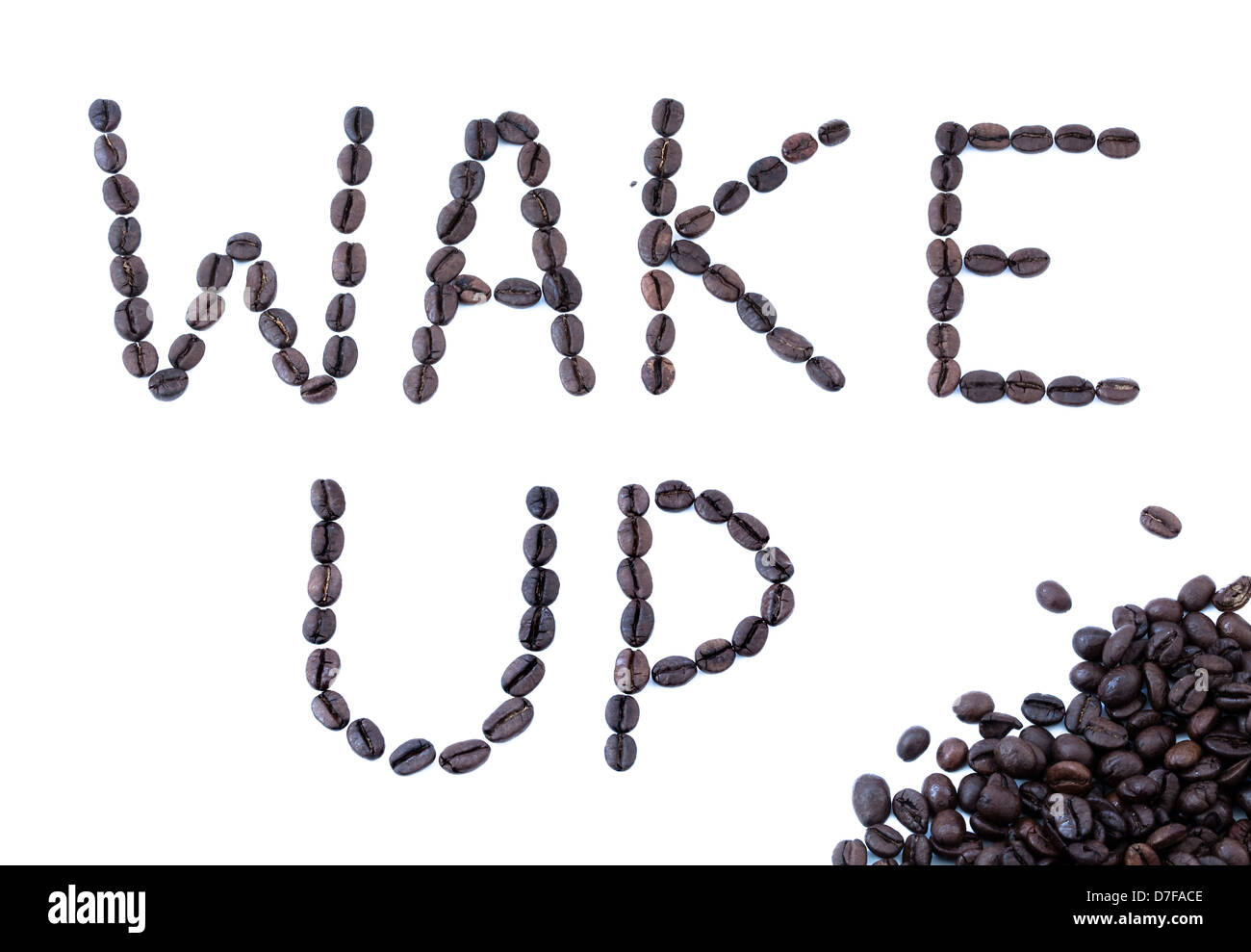 The phrase 'Wake Up' written with coffee beans. Stock Photo