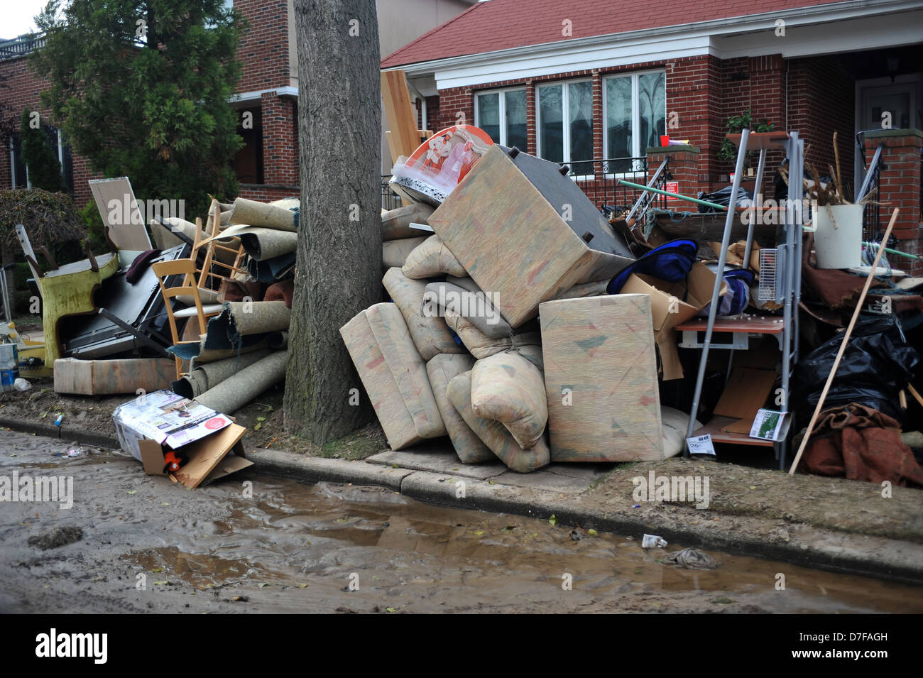 BROOKLYN, NY NOVEMBER 01 People cleaning debris from houses at the