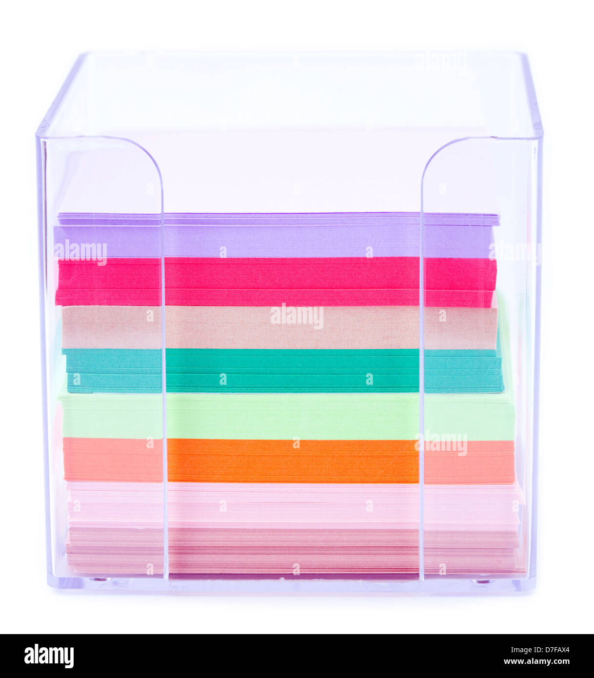 A colorful stack of notes inside a transparent plastic note holder. Shallow depth of field Stock