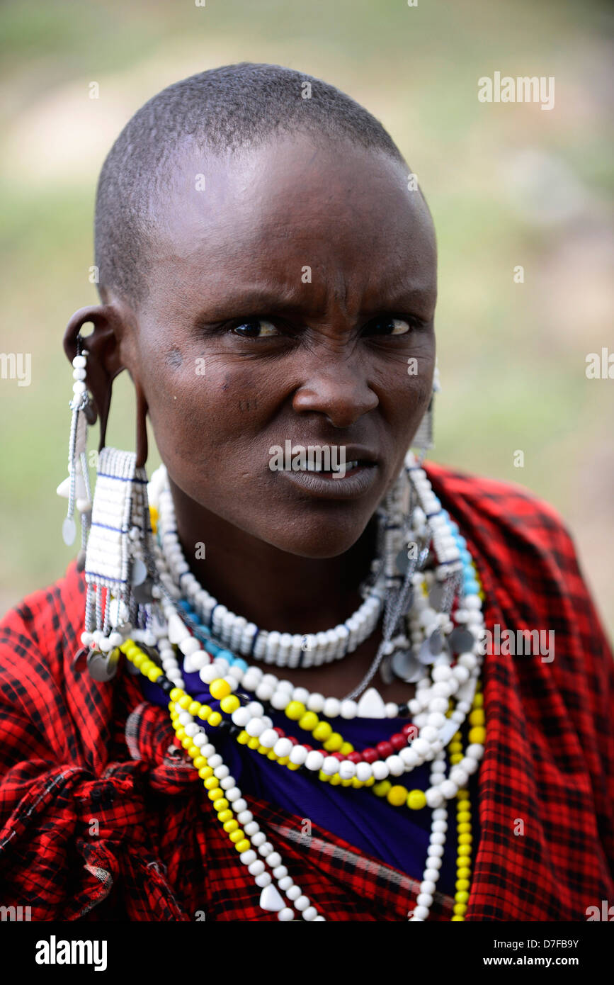 A Masai woman wearing colorful earrings. Stock Photo
