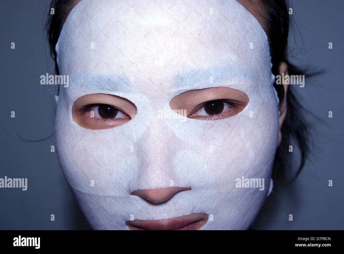 Asian woman with facial mask Stock Photo