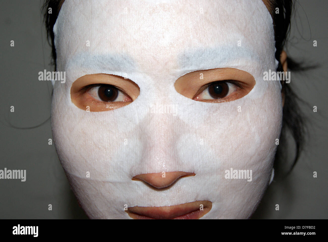 Asian woman with facial mask Stock Photo