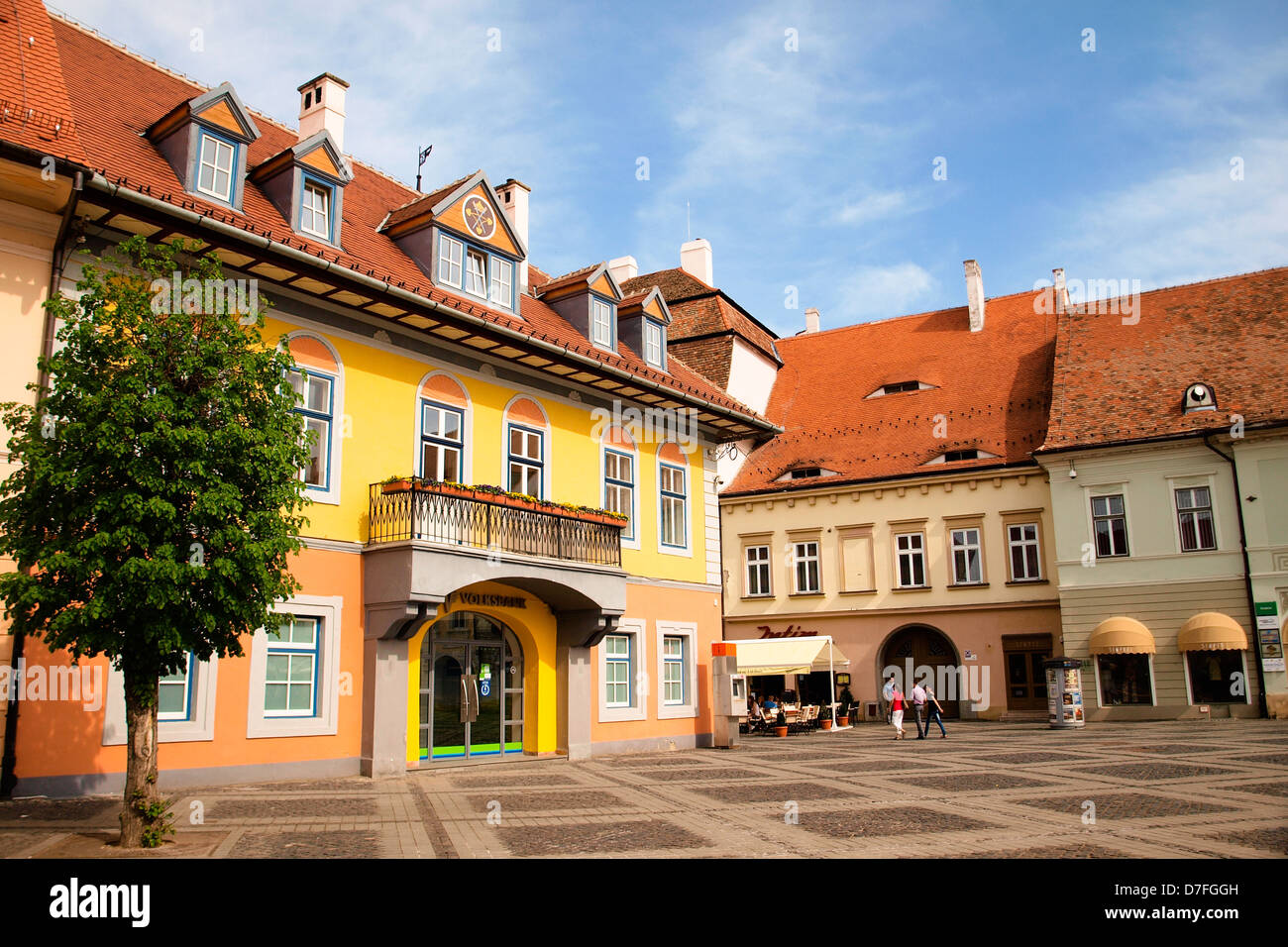 Sibiu, Central Square, the German Forum building, with the coat of arms. European medieval architecture. Stock Photo