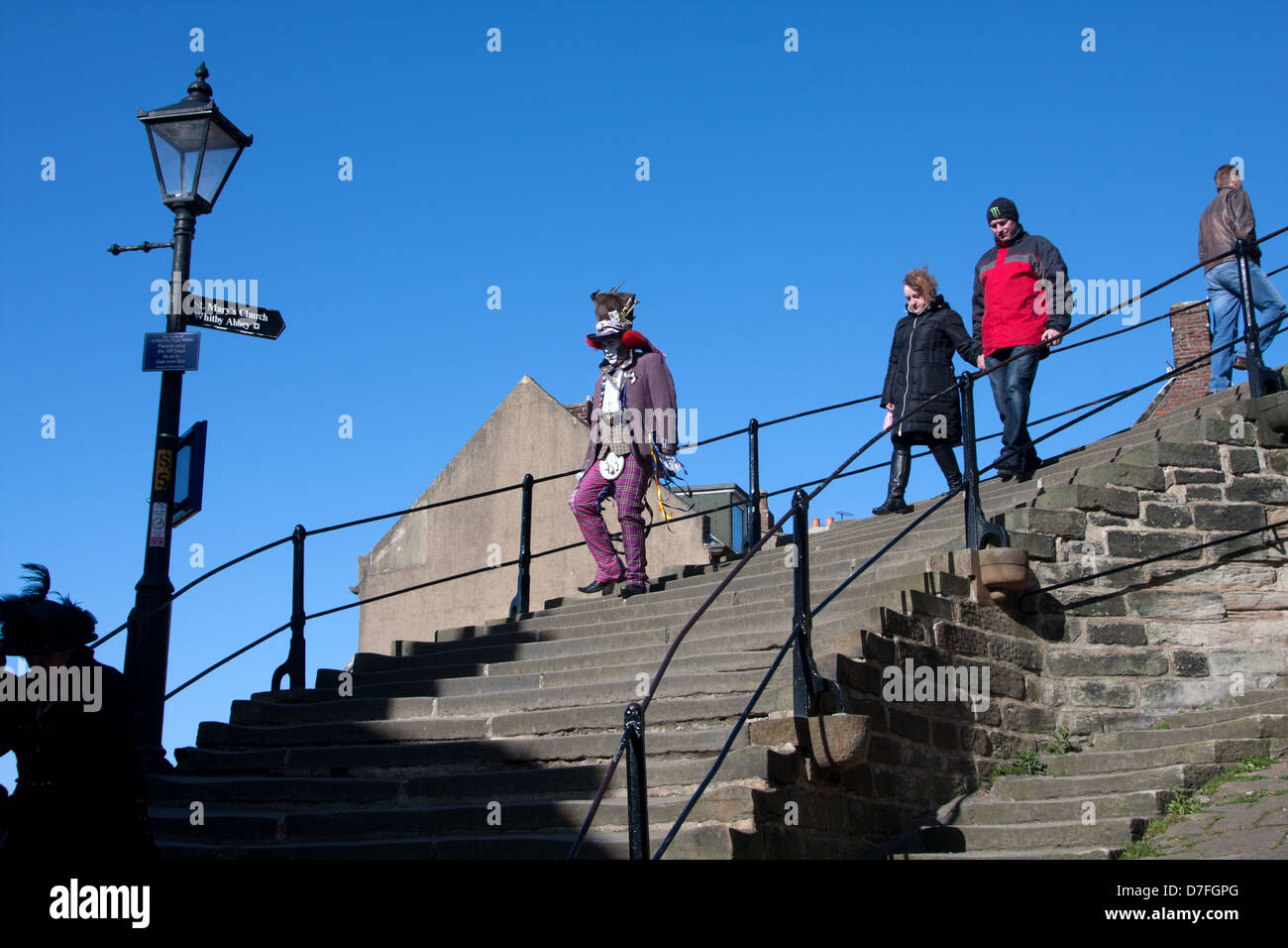 A goth walks down the 199 steps in Whitby Stock Photo