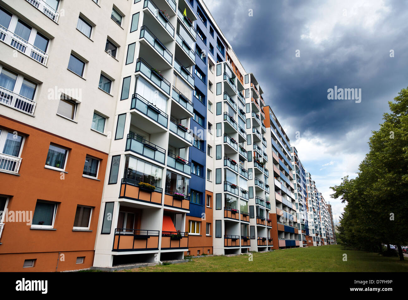 Tight block of buildings in various colors on an inclement day in Heinrich Heine Street, East Berlin, Germany. Stock Photo