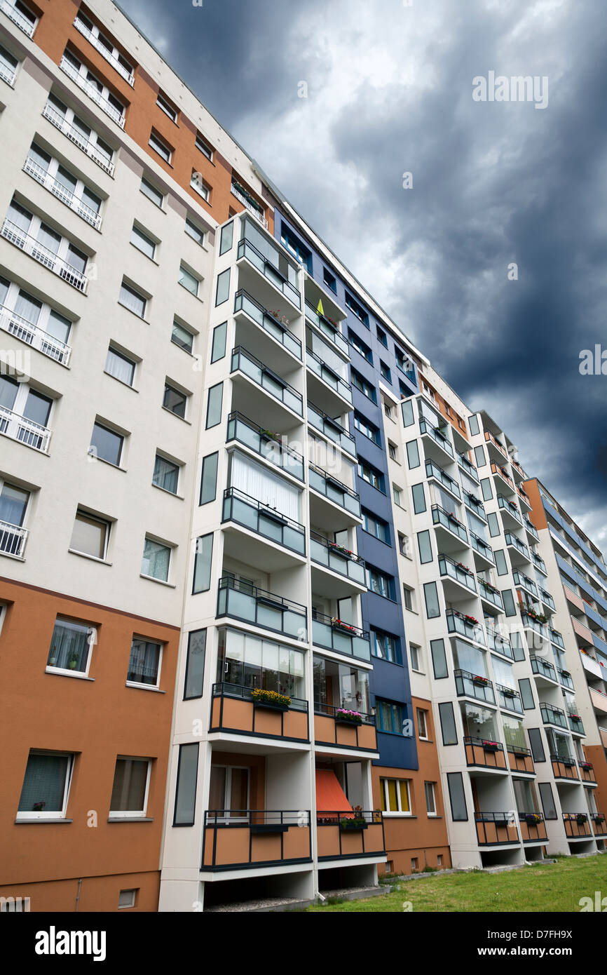 Tight block of buildings in various colors on an inclement day in Heinrich Heine Street, East Berlin, Germany. Stock Photo