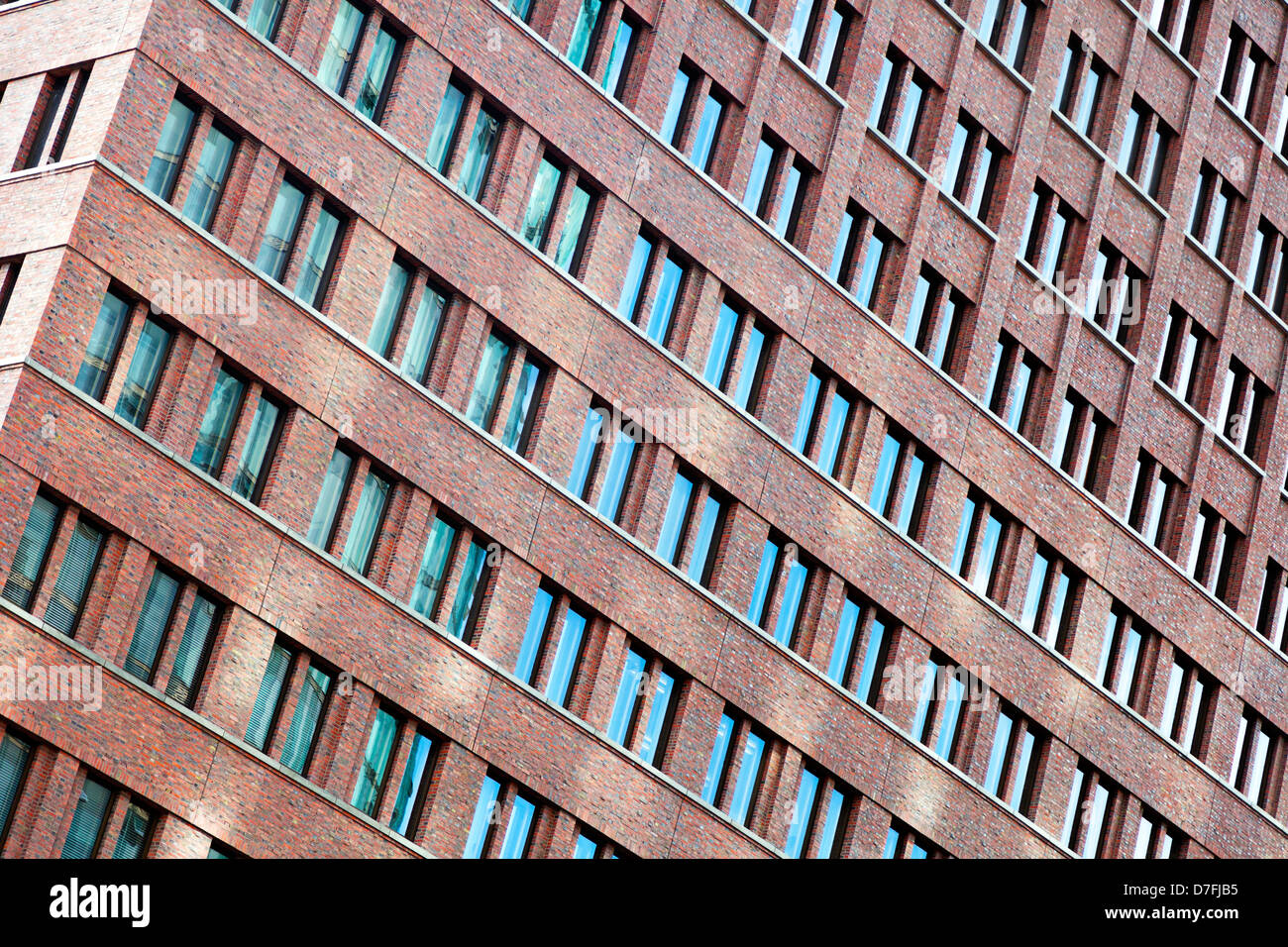 Tilted view at the pattern of windows on a tall building Stock Photo ...