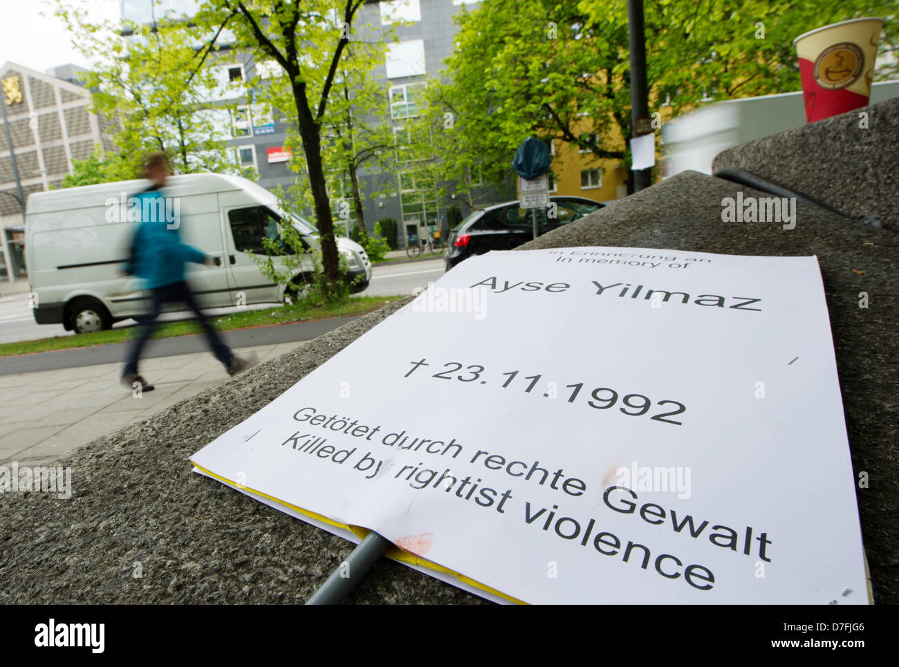 A sign which reads 'Ayse Yilmaz - 23.11.1992 - Getoetet durch rechte Gewalt - Killed by rightist violence' sits on the wall in front of the Higher Regional Court in Munich, Germany, 07 May 2013. The trial of the murders and terror attacks of the National Socialist Underground (NSU) started in Munich on 06 May and will be continued on 14 May. Photo: INGA KJER Stock Photo