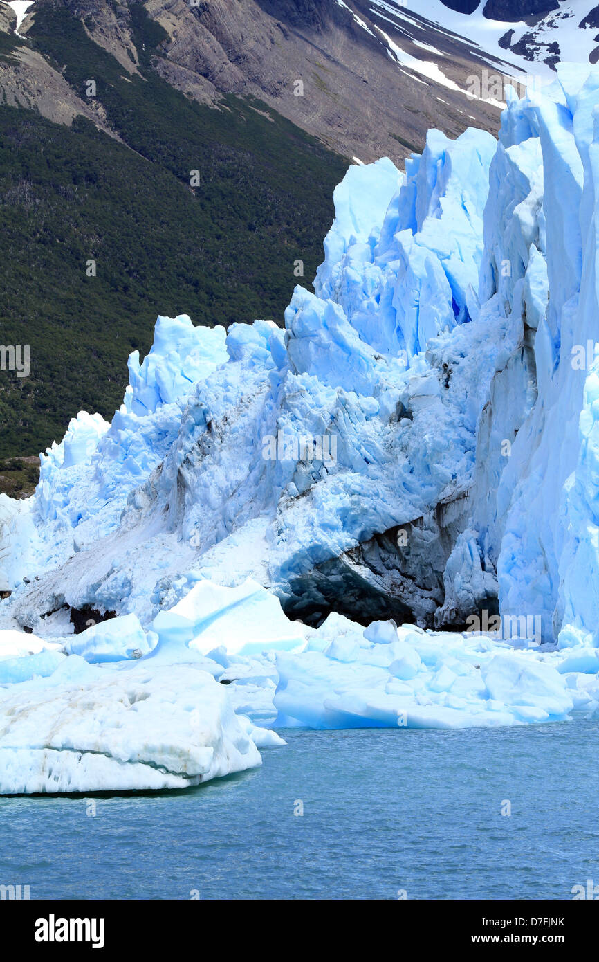 Glacier part infront of a mountain on the water of a lake in Patagonia, South America. Stock Photo