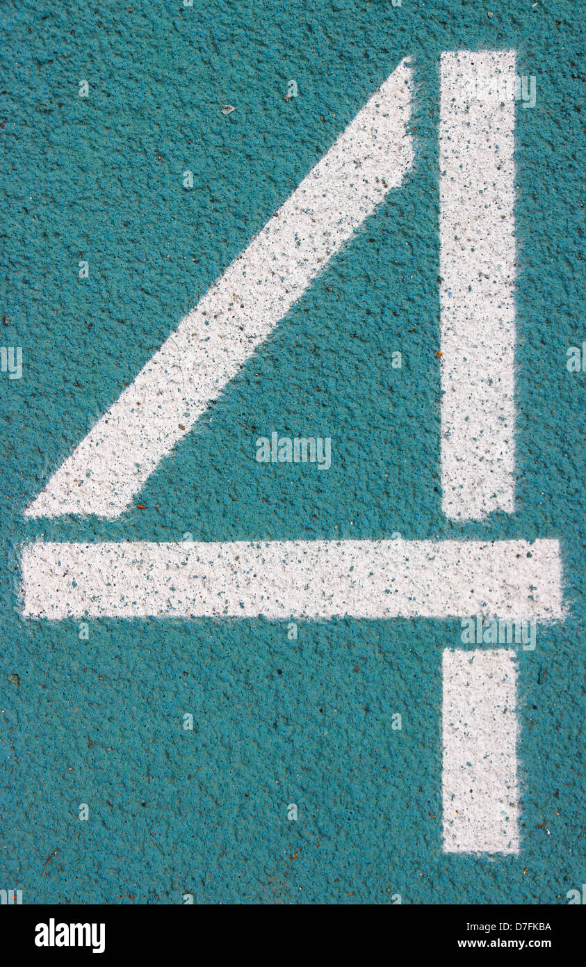 digit 4 on a blue athletics track Stock Photo