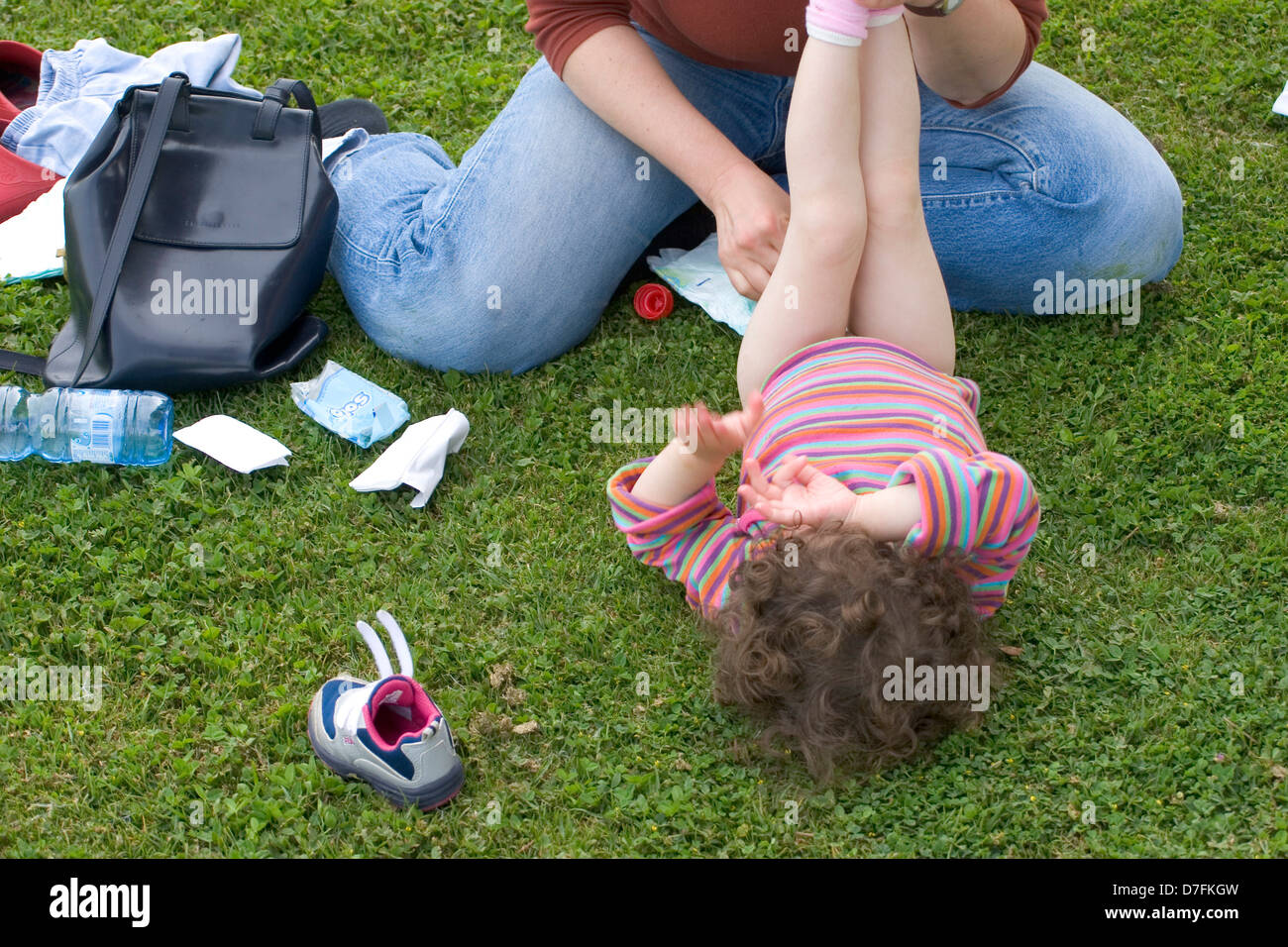 Mother Changing Diaper For Her Baby Stock Photo Alamy