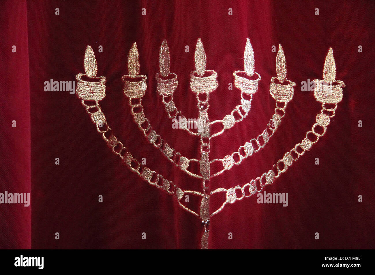 Menorah is embroidered on the Holy Ark's curtain at Tykocin (Tiktin) Synagogue, Poland Stock Photo