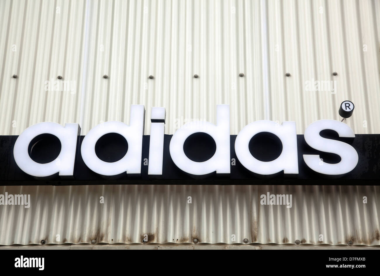 Tel-Aviv Israel - 10th Marcj 2011: Adidas trademarked brand name on  background squiggly metal. Adidas is largest sportswear Stock Photo - Alamy