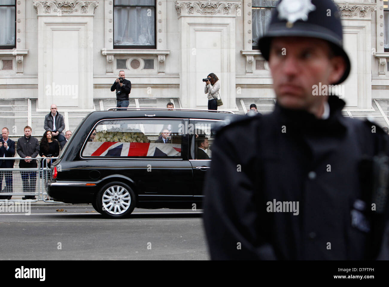 the hearse carrying margaret thatcher'S coffin passes downing st. in whitehall during the THE FUNERAL OF BARONESS THATCHER Stock Photo