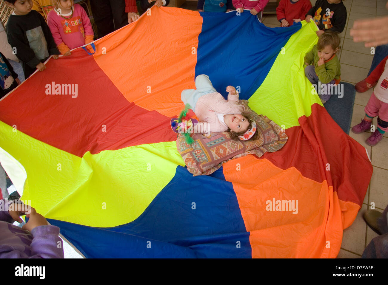 two years old child celebrating birthday at nursery Stock Photo