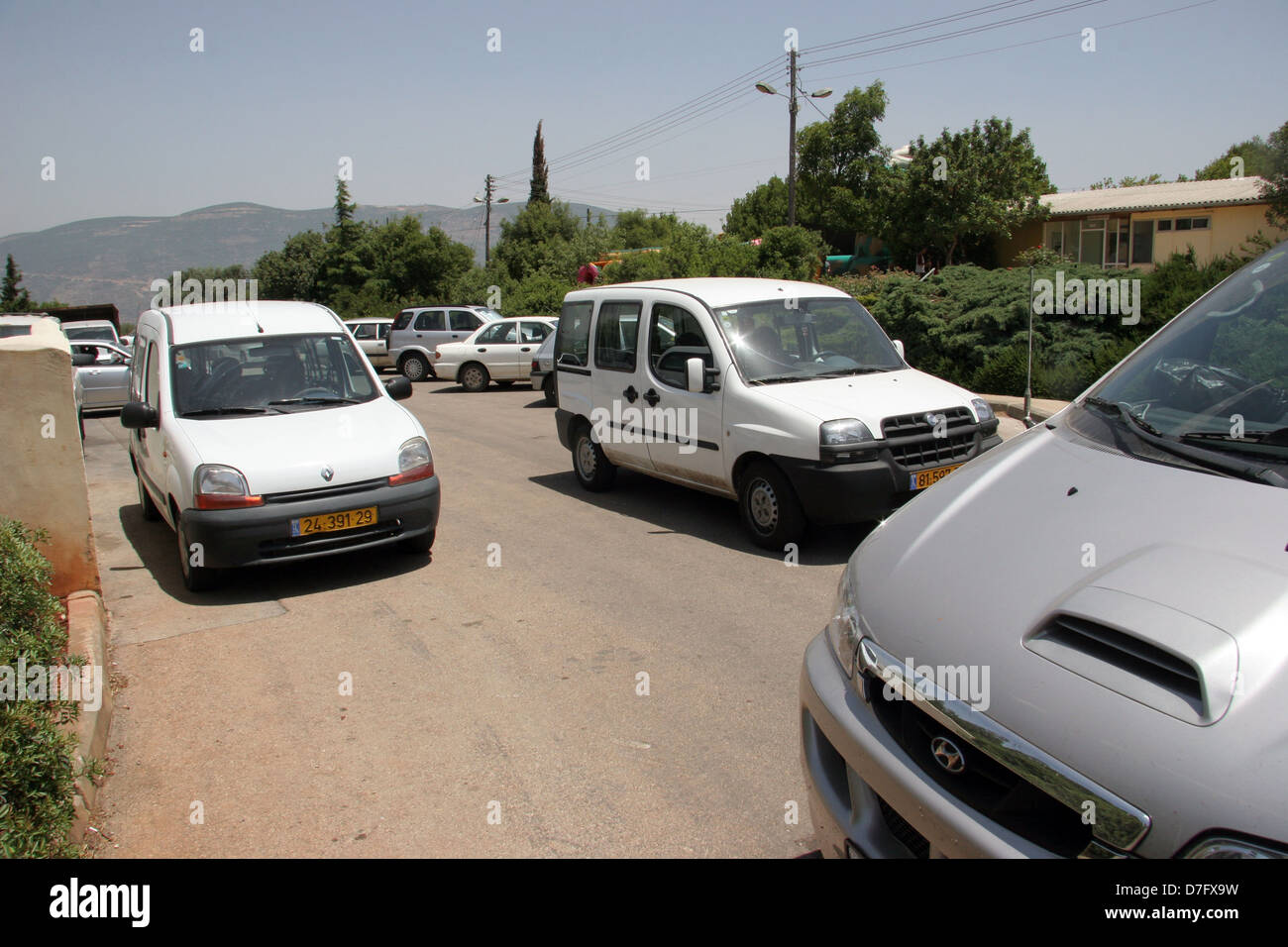 crowded parking in the village of kammon, galilee Stock Photo Alamy