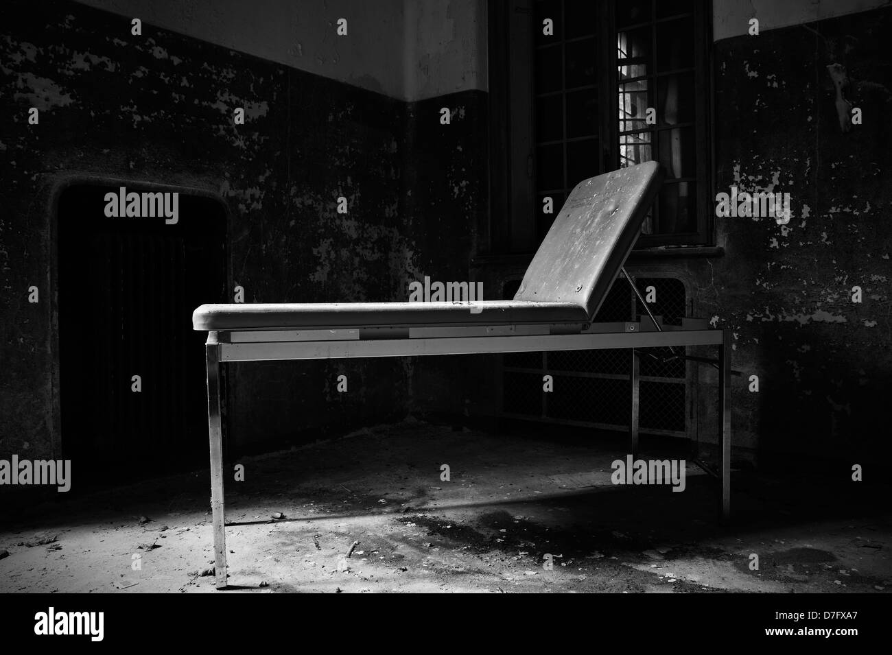 Abandoned hospital ruined medical bed Stock Photo