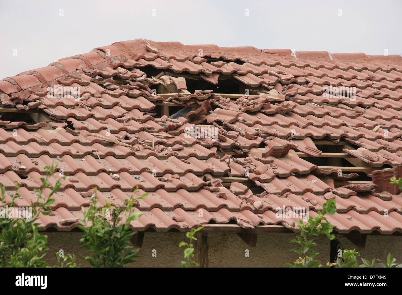 damaged house from fragments of a katyusha hit on karmiel (2006) Stock Photo