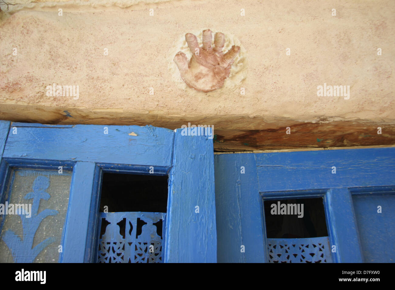 palm imprinted above door at house made of clay in sataf Stock Photo
