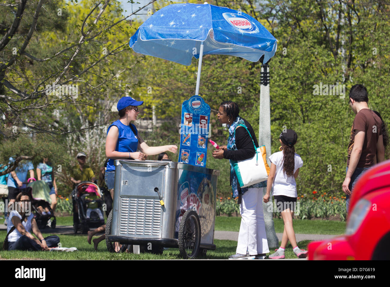 Portable Ice Cream stand with woman buying ice cream Stock Photo Alamy