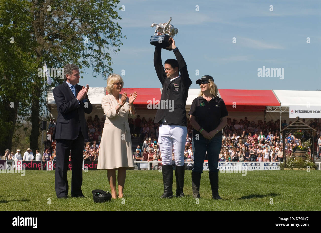Badminton Horse Trials, New Zealand's Jonathan Jock Paget triumphed in an extraordinary climax to Britain's Mitsubishi Motors Badminton Horse Trials, seen here with Uk chairman of Mitsubishi Motors Lance Bradley  prizes being handed out by HRH Duchess of Cornwall Camilla Parker Bowles, the groom to right of photo. He won on Clifton Promise. Badminton, Gloucestershire, England 6th May 2013. May 2013. 2010s UK  HOMER SYKES Stock Photo