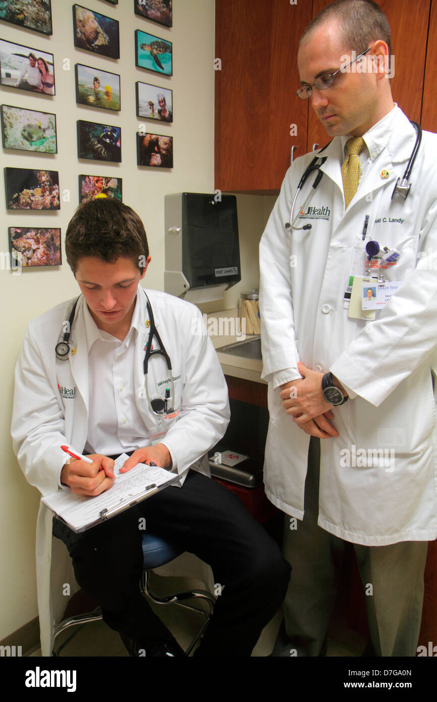 Miami Beach Florida,Mt. Mount Sinai Medical Center,centre,health,examination room,man men male adult adults,intern,doctor,student students survey,ques Stock Photo