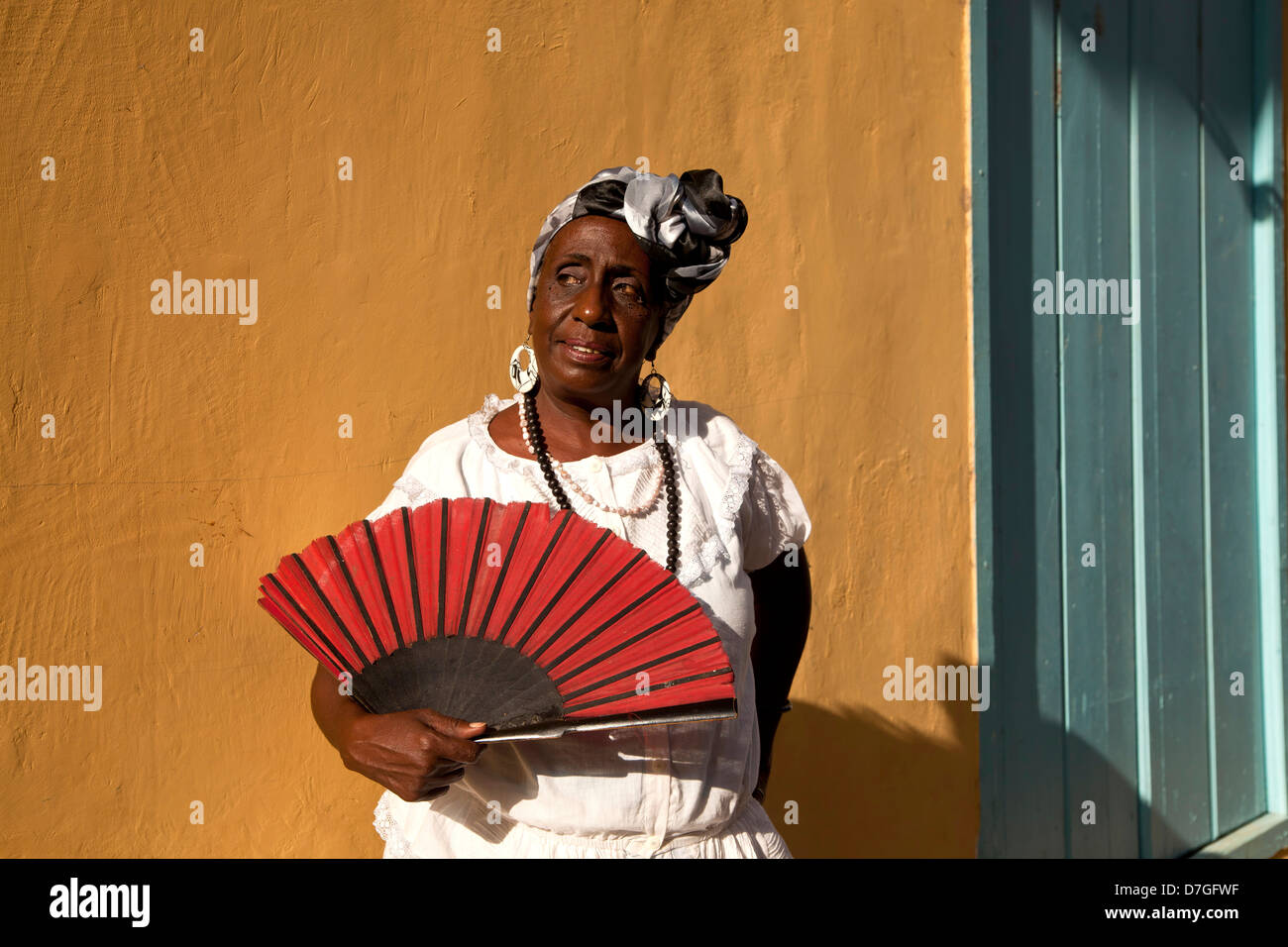 cuban woman with red folding fan in Havana, Cuba, Caribbean Stock Photo