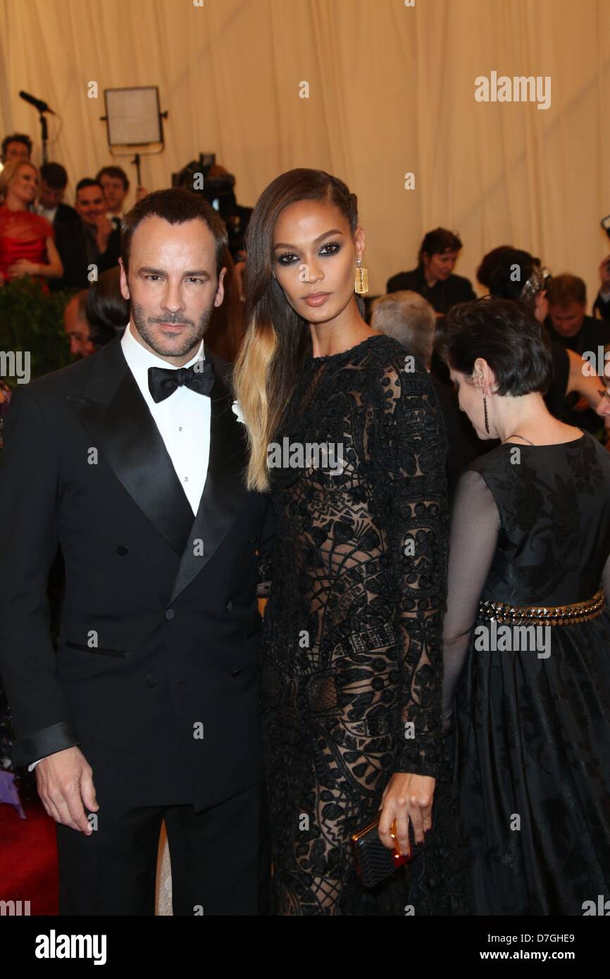 Model Joan Smalls and designer Tom Ford arrive at the Costume