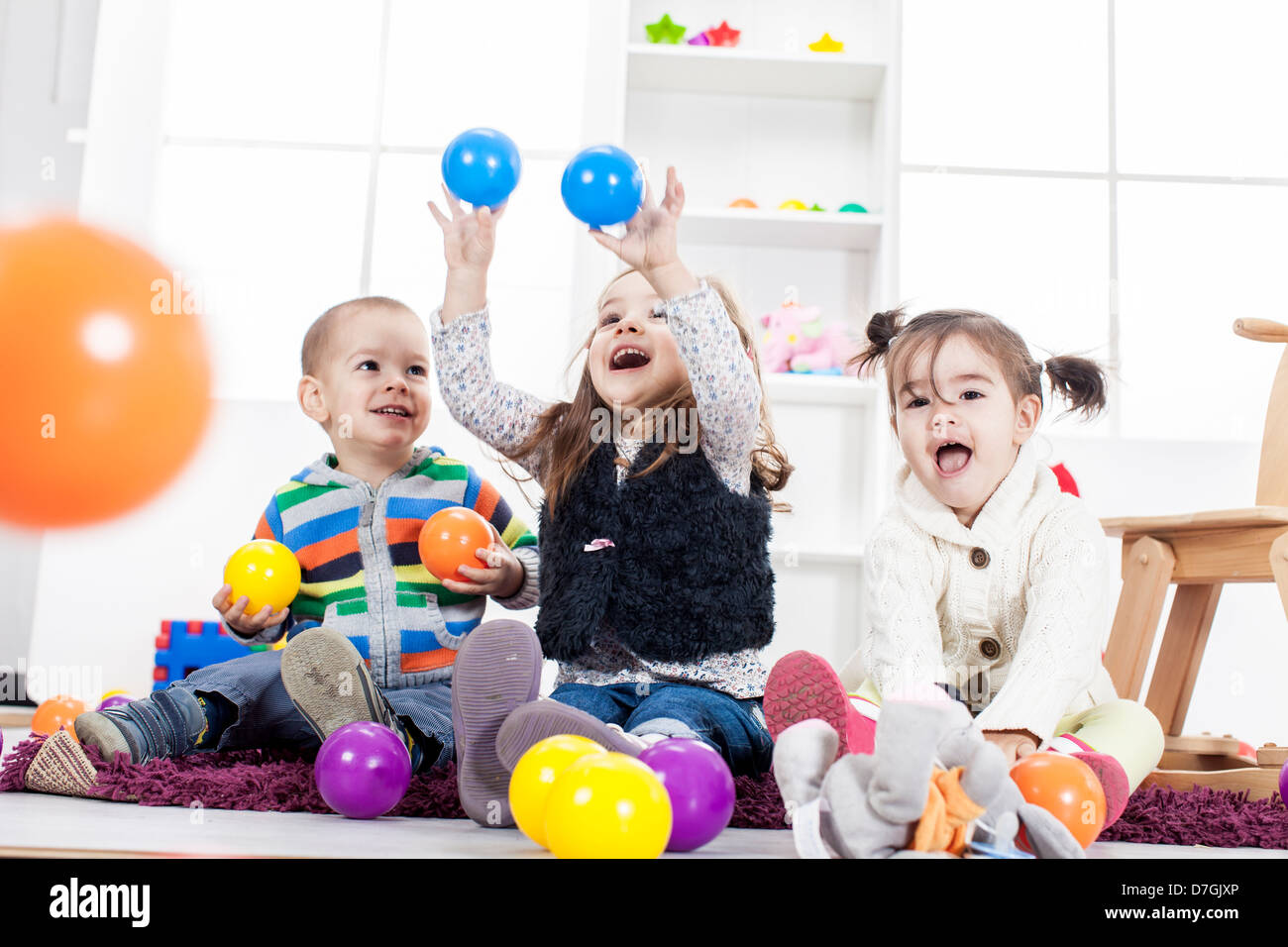 Cute kids playing in the room Stock Photo