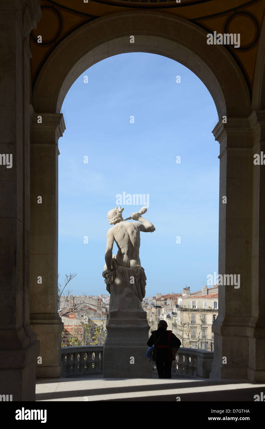 Triton Statue at the Palais Longchamp or Longchamp Palace & Tourist with View over Marseille Skyline Provence France Stock Photo
