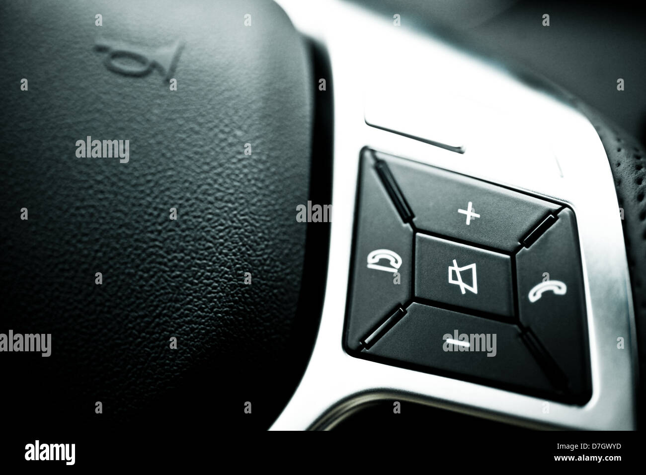 Detail on volume and call buttons on a steering wheel Stock Photo