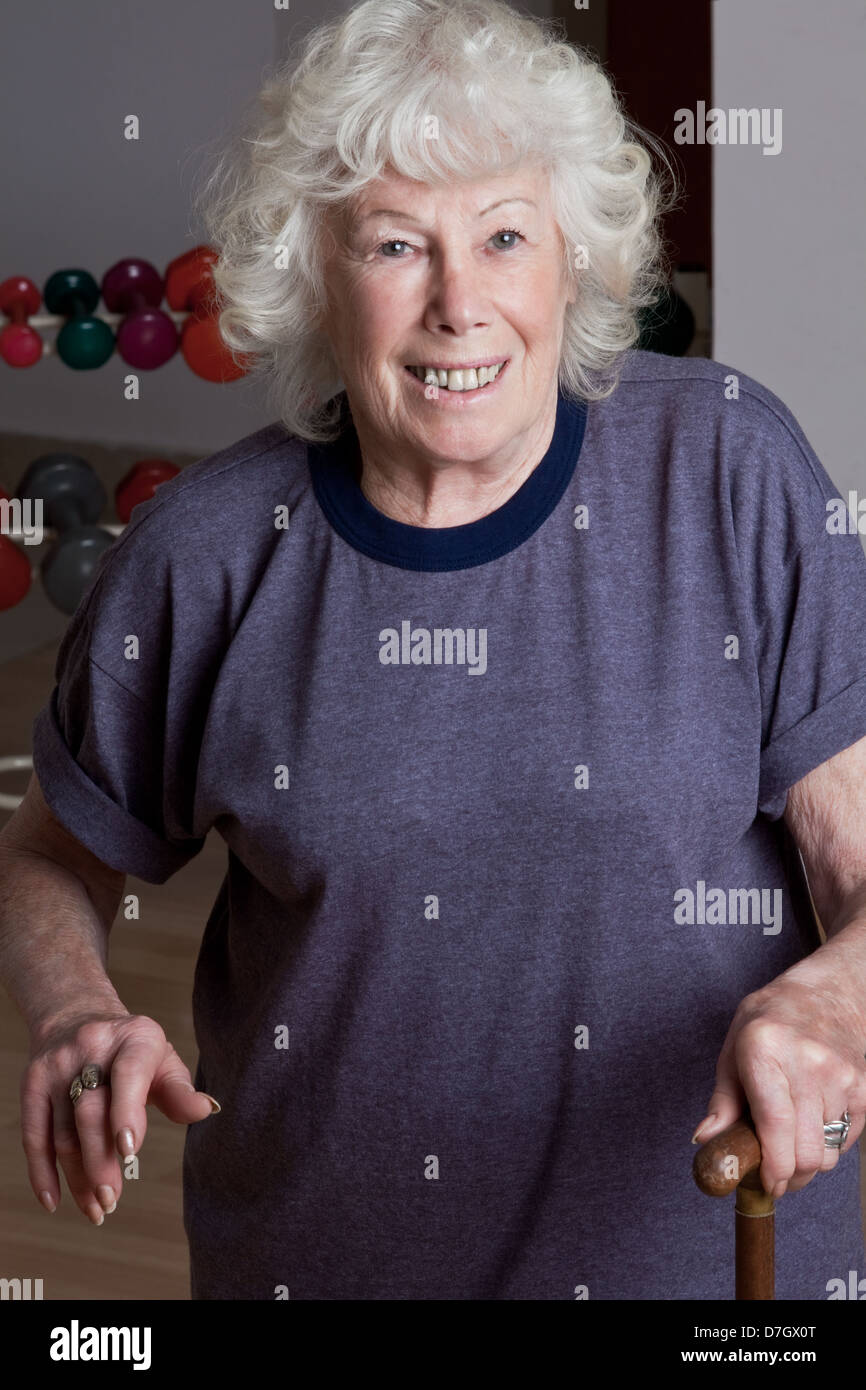 Senior Woman with Walking Stick Stock Photo - Alamy