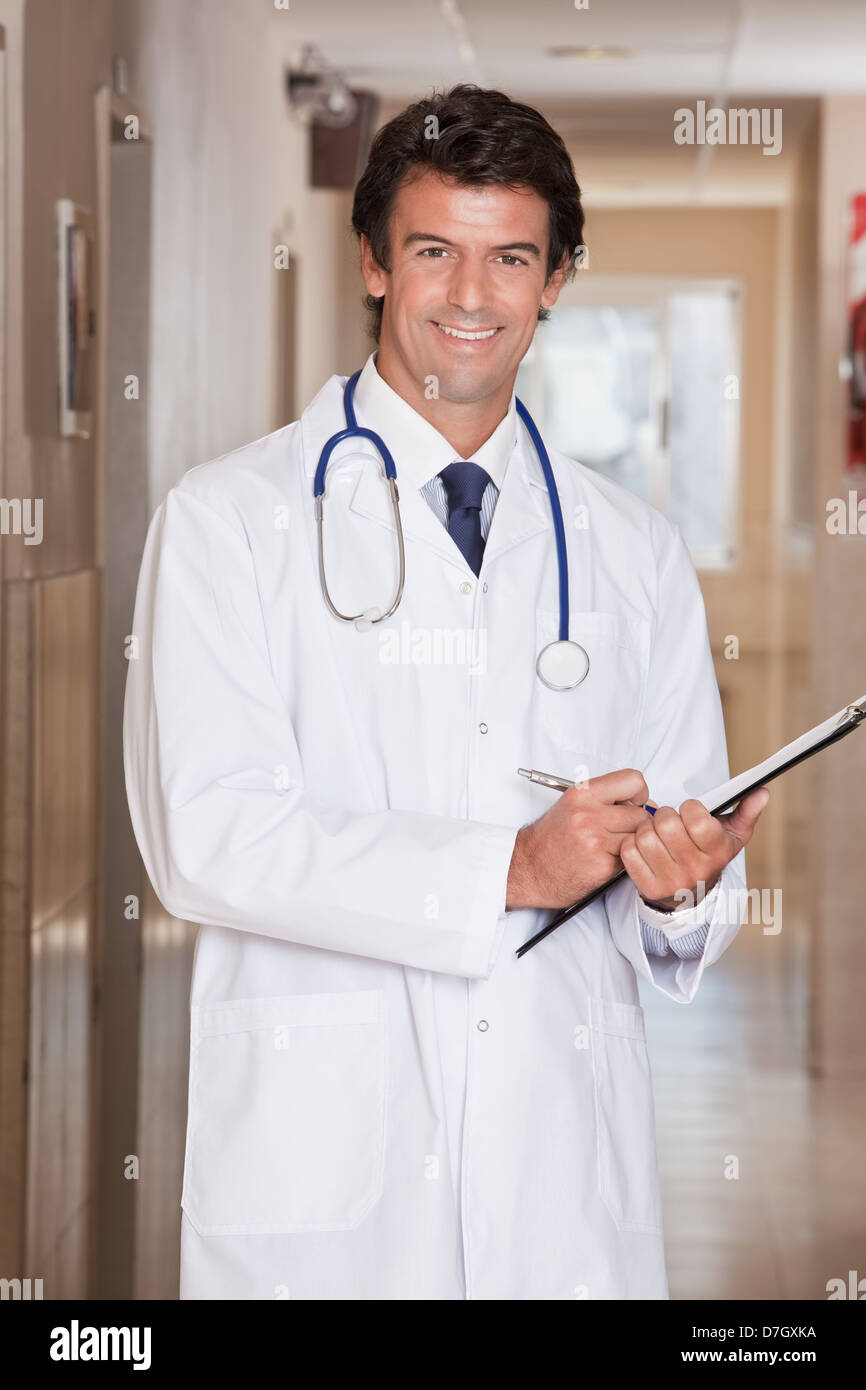 Male doctor standing folder hi-res stock photography and images - Alamy