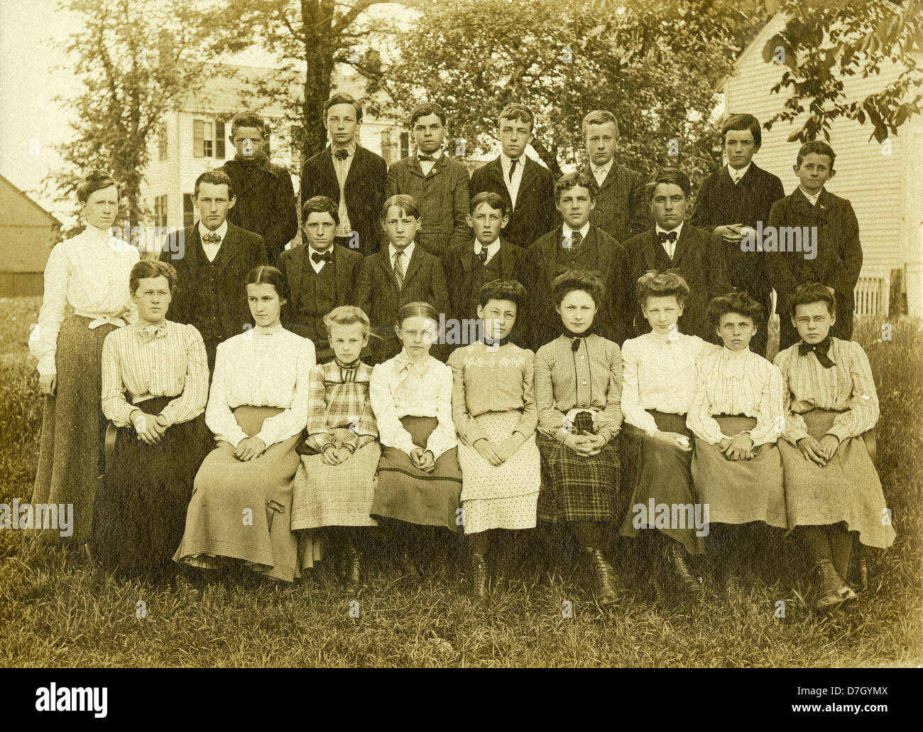 Circa 1900 school photo, showing a group of schoolboys and girls aged 10-14 years old. Stock Photo