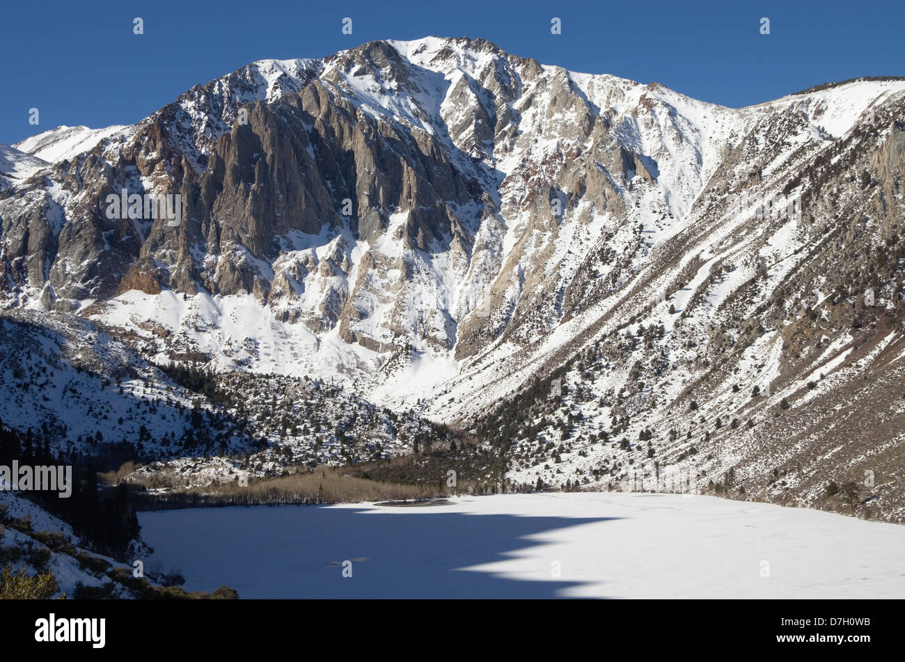 Laurel Mountain in the winter above a frozen Convict Lake Stock Photo