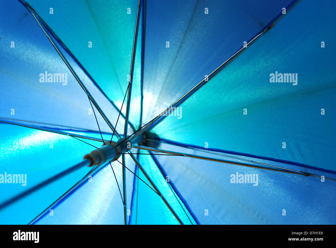 Translucent blue umbrella seen below transparent some light Stock Photo Alamy