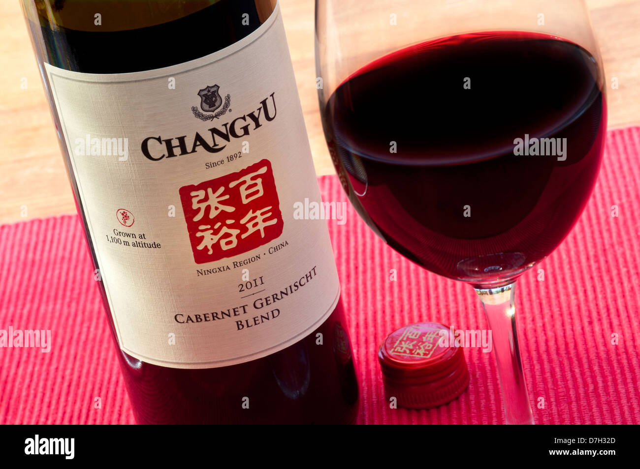Bottle and glass of 2011 Chinese 'Changyu' Cabernet Gernischt red wine from Ningxia region of China Stock Photo
