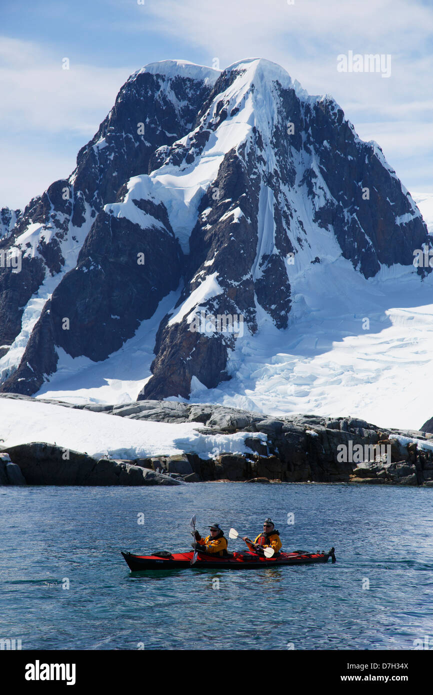 Kayakers at Petermann Island, Antarctica. Stock Photo