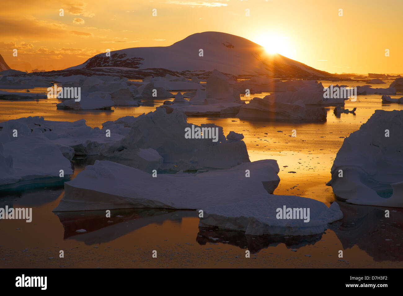 Giant icebergs at sunset in the Bellinghausen Sea, from Booth Island, Antarctica. Stock Photo
