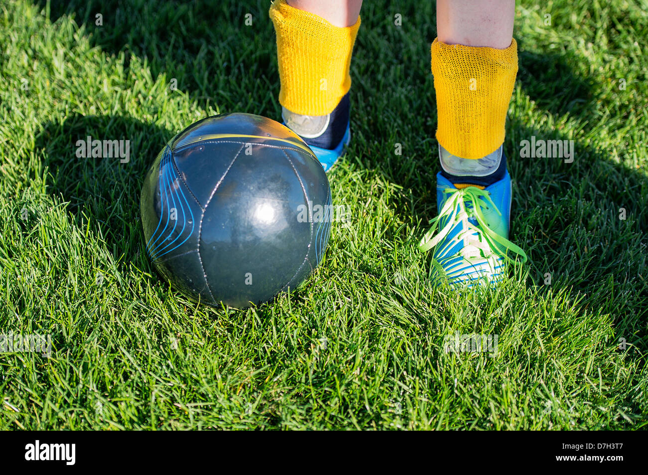 Youth soccer player with ball. Stock Photo