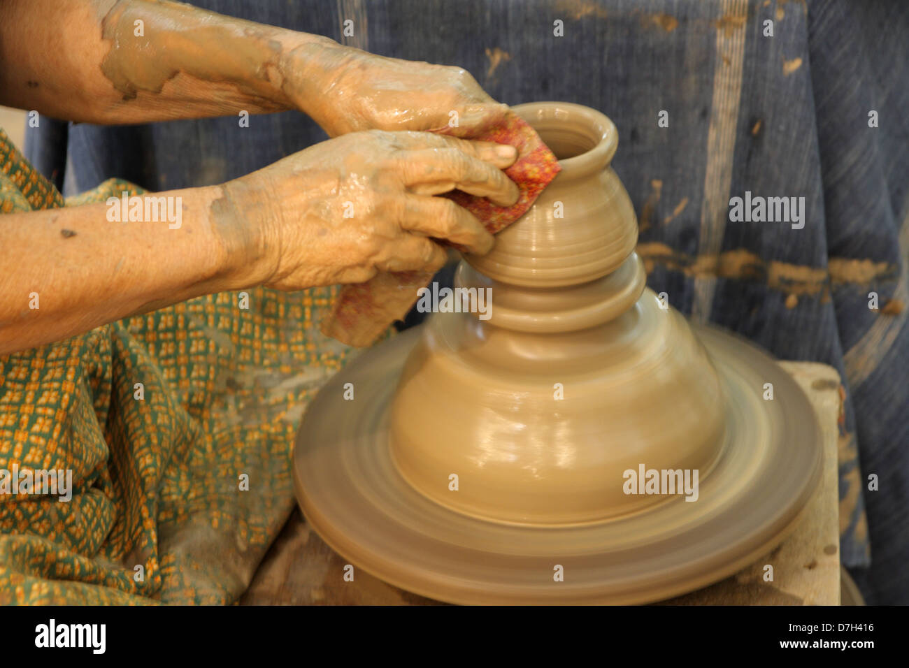 Handthrowing pottery on wheel to made Thai style pot Stock Photo Alamy