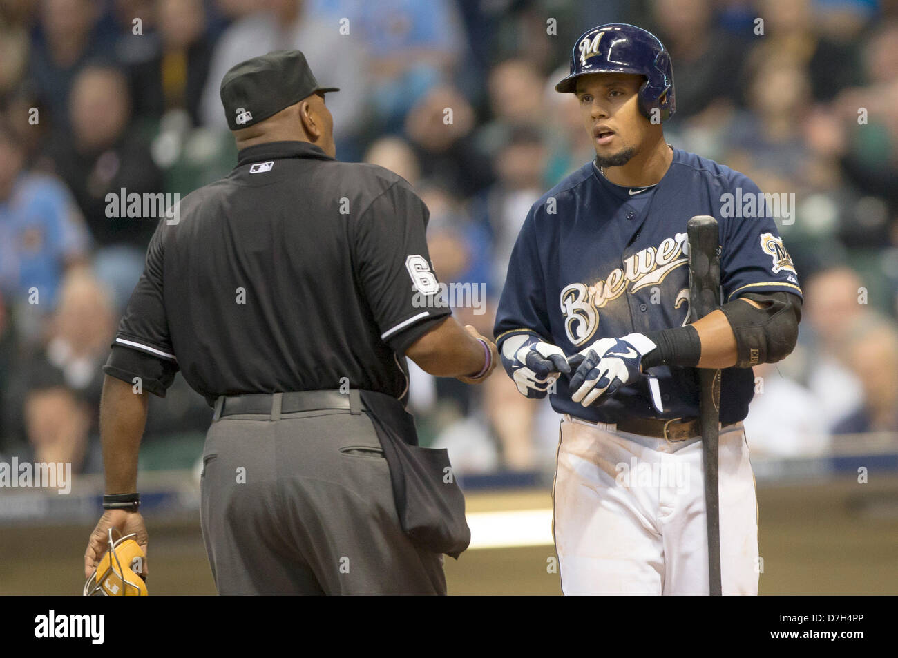 Milwaukee, Wisconsin, USA. 7th May 2013. Milwaukee center fielder Carlos Gomez #27 tries to explain to the home plate umpire that the pitch hit him. Milwaukee leads Texas 6-3 in the 8th inning at Miller Park in Milwaukee, WI. John Fisher/CSM/Alamy Live News Stock Photo