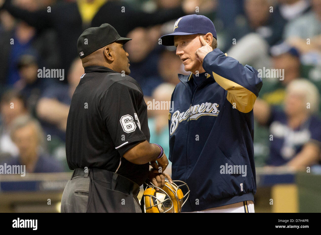 Milwaukee, Wisconsin, USA. 7th May 2013. Manager Ron Roenicke argues with the home plate umpire after a Gomez was hit by a pitch. Milwaukee leads Texas 6-3 in the 8th inning at Miller Park in Milwaukee, WI. John Fisher/CSM/Alamy Live News Stock Photo