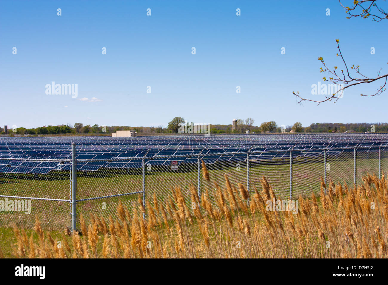 In Sarnia Ontario acres of farmland are covered with solar panels to produce energy from the sun at this large scale solar farm. Stock Photo