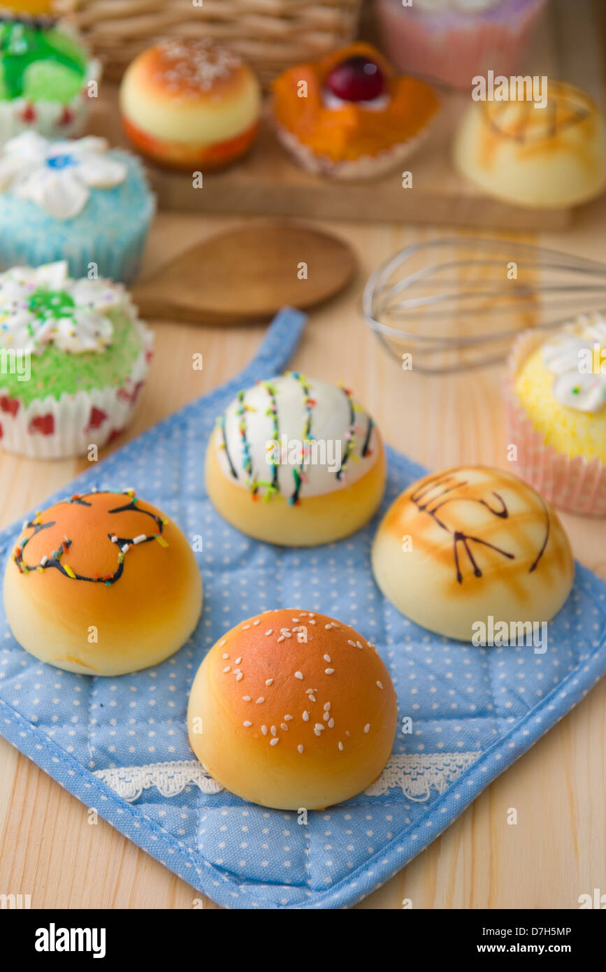 sweet vanilla bun cake bread with pastry decorations as background Stock Photo