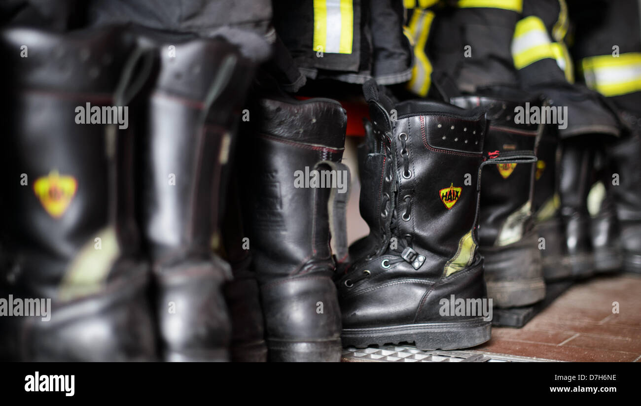Fire Boots in the locker room of a fire station. Stock Photo