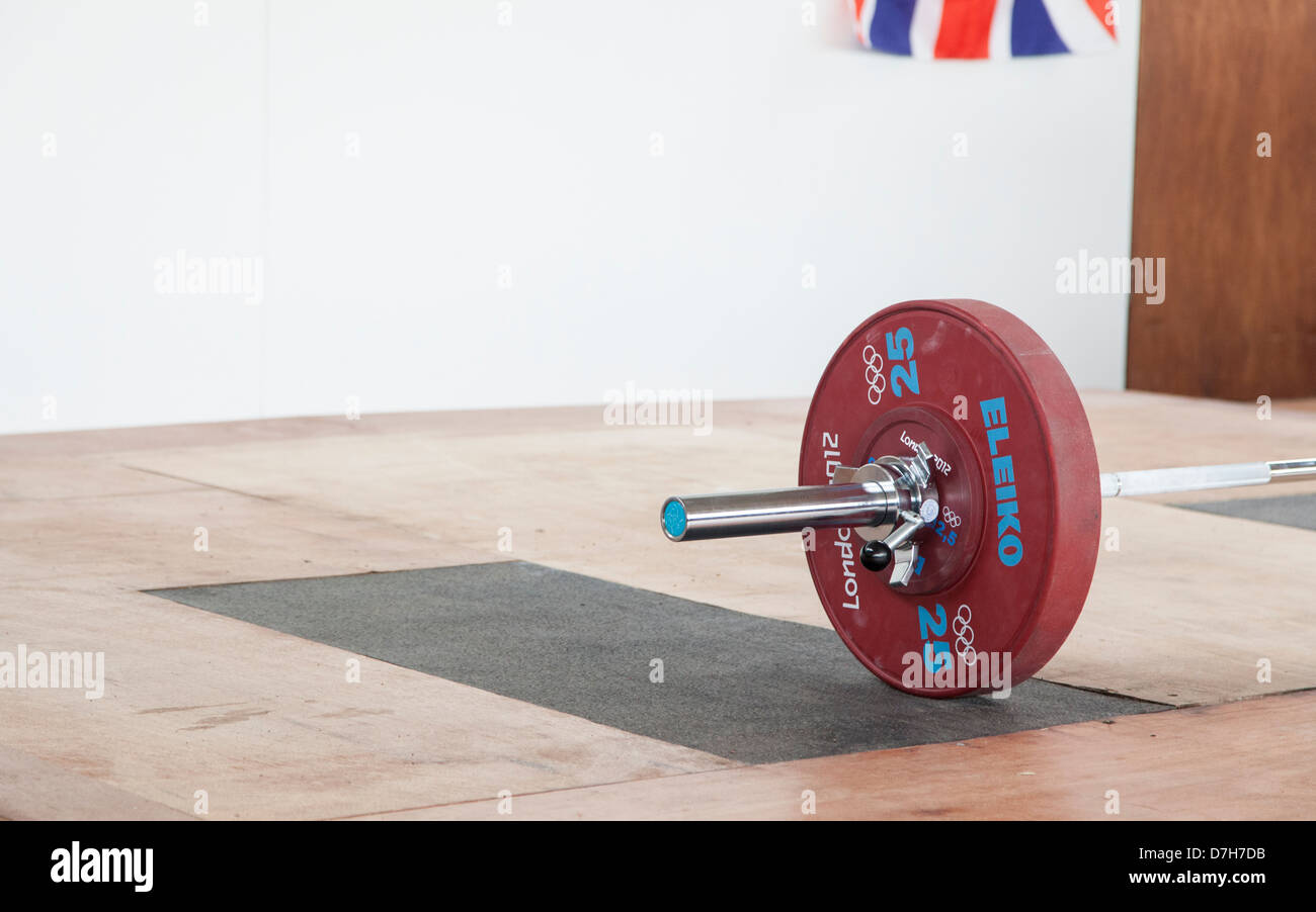 London 2012 weightlifting plate, 25 plate, red plate and olympic bar, GB Flag top right corner. Stock Photo